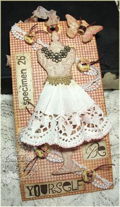 a card with an image of a white dress on it and some butterflies around it