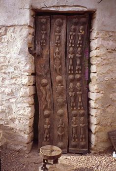 an old door with carvings on it and the words wooden doors written in black ink