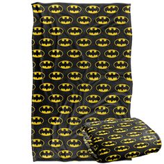 batman bedding set with black background and yellow bat symbol on the front, two matching sheets