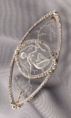 René Lalique - An Art Deco Glass Intaglio and Diamond Brooch. The reverse engraved to depict young woman among scrolling boughs, set with old mine and rose-cut diamond accents, platinum mount, lg. 2 1/4 in. Ancient Jewels, Art Deco Glass, Carved Stone, Diamond Brooch, Shiny Things