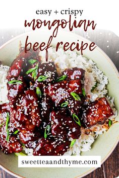 a bowl filled with rice and meat covered in bbq sauce on top of a wooden table