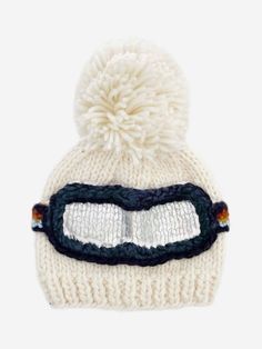 The perfect beanie for little skiers, and non-skiers alike. Our Cream ski hat featuring a Navy, Cinnamon, Mustard, and Bowie Grey goggle band is the perfect blend of warmth, comfort, and style, while the pom-pom and silver metallic details add dimension and design to this epic beanie. Pair with our Classic Cream, Navy, Cinnamon, or Bowie Grey Cardigan or Mittens for a complete look. Final design may vary slightly from the pictured mockup. Crafted with care using 100% Hand-knit Acrylic All measur Baby Skiing, Retro Ski, Ski Hat, Muslin Swaddle Blanket, Baby Gift Box, Ski Hats, Hand Knit Hat, Ski Goggles, Retro Stripes