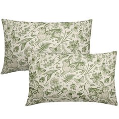 two pillows with green and white designs on them