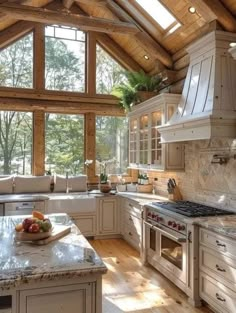 a large kitchen with an island in the middle and lots of counter space on one side