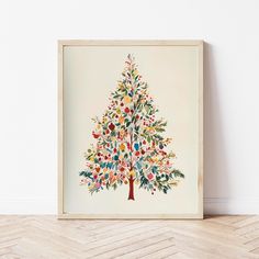 a colorful christmas tree on a white wall