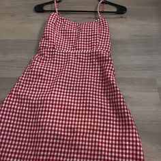 It Is A Red And White Checkered Printed Dress For The Occasion To Go To A Picnic Or A Date. This Dress Is Brand New And Has Never Been Worn. Red A-line Mini Dress For Summer, Red A-line Sundress For Summer, Red A-line Dress For Picnic, Summer Red Mini Dress For Picnic, Red Mini Dress For Summer Picnic, Red Summer Sundress For Picnic, Red Sleeveless Dress For Picnic, Red Knee-length Dress For Picnic, Red Knee-length Cotton Mini Dress