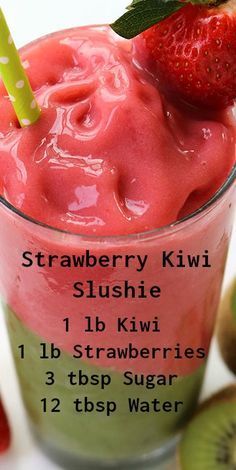 strawberry kiwi slushie in a glass with strawberries