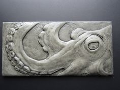 an octopus sculpture is shown on the wall