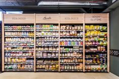 an empty grocery store filled with lots of different types of food and drinks on shelves