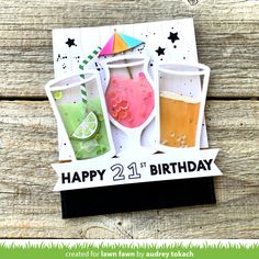 a happy 21st birthday card with three drinks