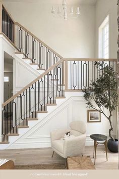 a living room filled with furniture and a stair case