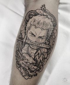 a man's arm with a tattoo on it and an image of a demon