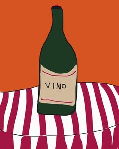 a bottle of wine sitting on top of a striped table cloth next to an orange wall