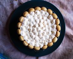 a cake with marshmallows on top sitting on a plate