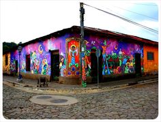 a colorful building with lots of paintings on it