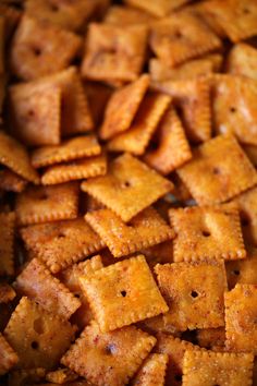 a pile of cheesy crackers sitting on top of a table