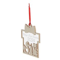 a christmas ornament hanging from a red ribbon