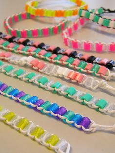 several different colored bracelets on a table