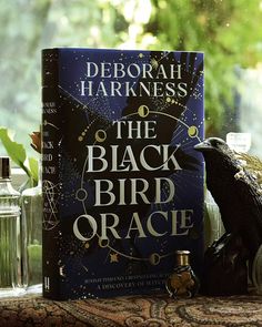 the black bird oracle by deborah harkness on a window sill