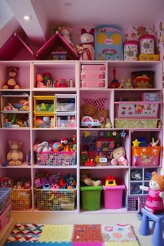 a child's playroom filled with lots of toys and stuffed animals on shelves