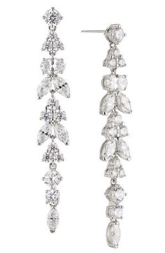 These linear drop earrings featuring circular and marquise-cut cubic zirconia bring powerful shine to eveningwear. 2 1/8" drop; 1/4" width Post back 18k-gold plate or rhodium plate/cubic zirconia Imported Strap Sandals Women, Crystal Drop Earrings, Crystal Drop, Faceted Crystal, Ankle Strap Sandals, Wedding Accessories, Clip On Earrings, Diamond Bracelet, Wedding Jewelry