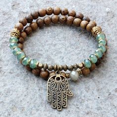 Wood and green crystal 54 bead wrap mala bracelet with Hamsa hand by #lovepray #jewelry Mala Bracelet, Styl Boho, A Bracelet, Beaded Wraps, Green Crystal, Hamsa Hand, Jewelry Projects, Metal Beads, Paracord