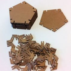 several pieces of cardboard cut out to look like hexagons and other shapes