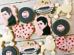 decorated cookies with elvis presley on them are laid out in front of a wooden background