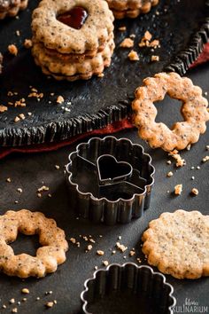 cookies and cookie cutters sitting on top of a table