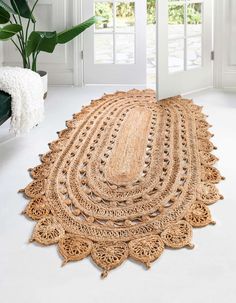 the rug is made out of jute and has an intricate design on top of it