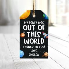 a black and white tag that says, my party was out of this world thanks to you love andew