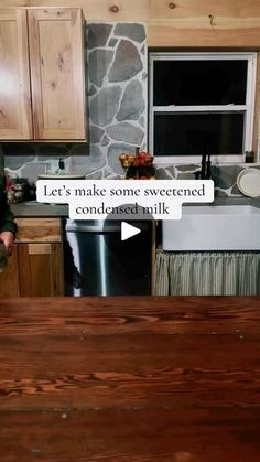 a woman standing in front of a kitchen counter