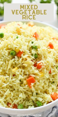 a white bowl filled with rice and vegetables