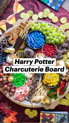 the harry potter character board is full of candy, candies and other foods on it