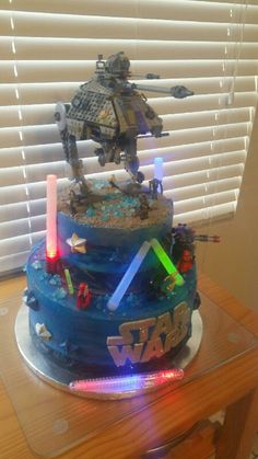 a star wars themed cake with lights on it