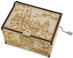 a small wooden box with an image of hogwarts castle on it