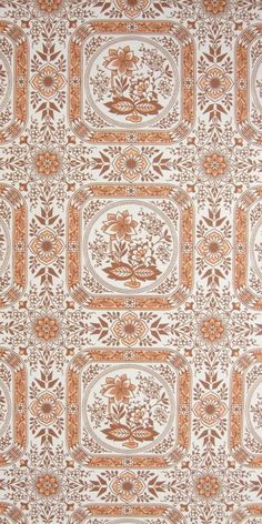 an orange and white wallpaper with floral designs