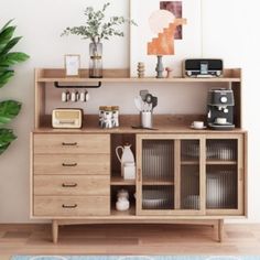 a wooden shelf with various items on it and a potted plant next to it