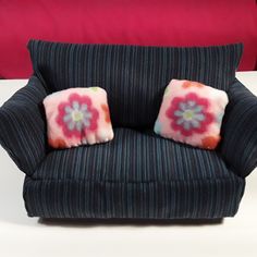 two pillows are placed on the back of a chair