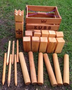 several wooden blocks are arranged next to each other in a box with the word kubb written on them