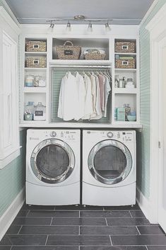 a white washer and dryer sitting in a laundry room next to each other