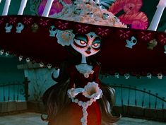 a doll is wearing a large hat with skulls on it's head and eyes