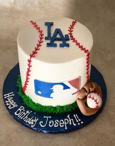 a birthday cake with a baseball and glove on it