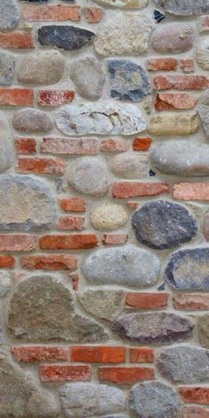 an image of a brick wall that is made out of bricks and stone mortars