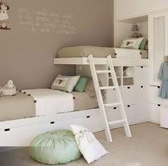 there is a bunk bed with a ladder next to it in the room that has two children's beds