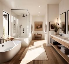 a large white bath tub sitting in a bathroom next to a walk in shower and sink