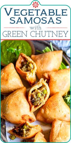 vegetable samosas with green chutney in the middle on a platter