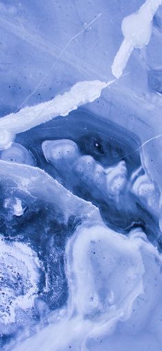 an abstract blue and white painting with ice on the bottom, water in the middle