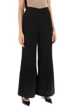 The Lucee pants by By Malene Birger are made of satin and feature a flared design. They have a hidden elastic waistband, French pockets, and a regular fit. The model is 177 cm tall and wears a size 34. Composition: 76% AC, 24% PL Pleats Please Issey Miyake, Malene Birger, By Malene Birger, Blazer Vest, Short Leggings, The Model, Knitwear Cardigan, Signature Style, Flip Flop