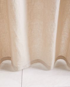 a close up view of a white curtain